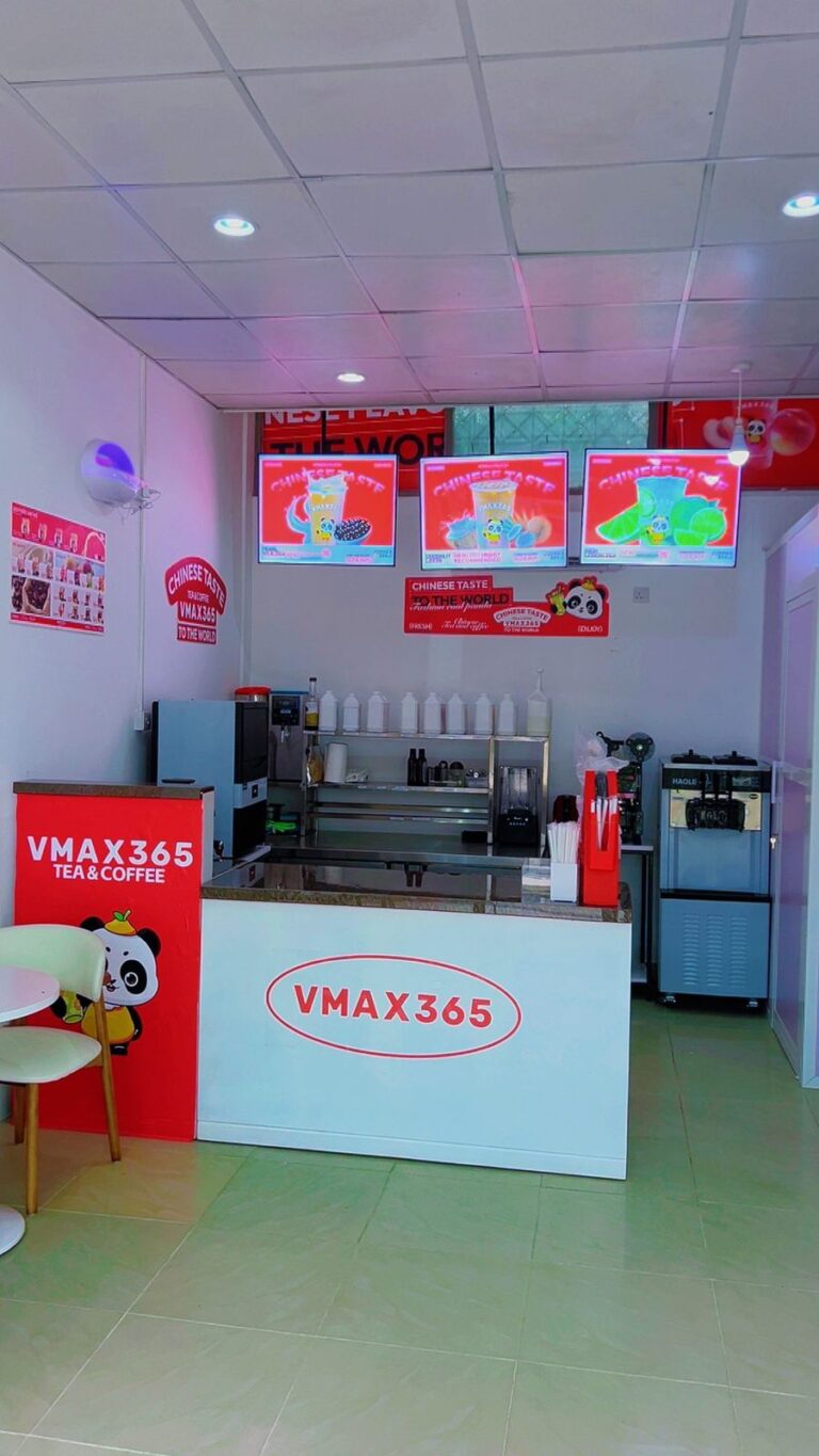 Service counter and digital menu boards at VMAX365 Tea & Coffee, Shamo Tower, Mbezi Beach