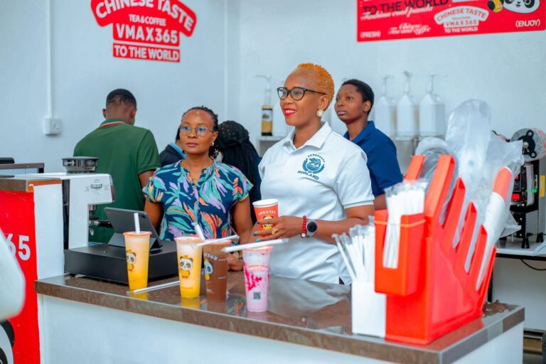 VMAX365 staff serving customers at the counter, Mbezi Beach, Dar es Salaam